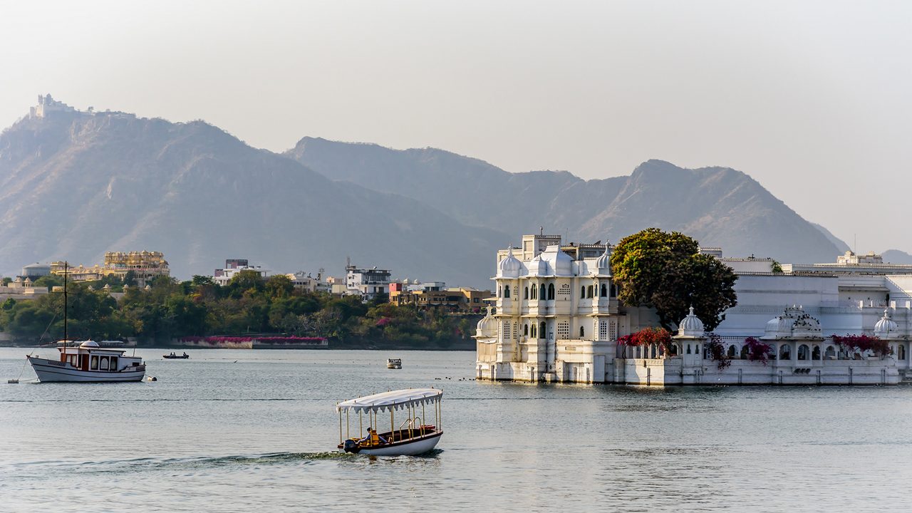 Taj Lake Palace on Lake Pichola in Udaipur India with the Aravali Mountain Range in the Background; Shutterstock ID 1072588754; purchase_order: -; job: -; client: -; other: -