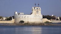 Beautiful Palace in middle of the lakhota lake Jamnagar India with white stone shine and water, Palace stock image