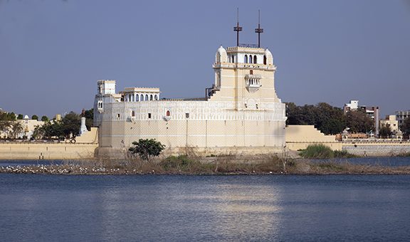 Beautiful Palace in middle of the lakhota lake Jamnagar India with white stone shine and water, Palace stock image