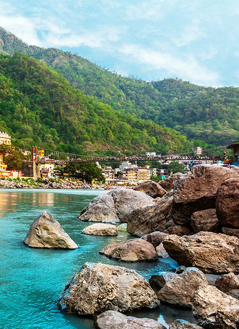 View of Ganga river embankment, Lakshman Jhula bridge and Tera Manzil Temple, Trimbakeshwar in Rishikesh