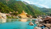 View of Ganga river embankment, Lakshman Jhula bridge and Tera Manzil Temple, Trimbakeshwar in Rishikesh