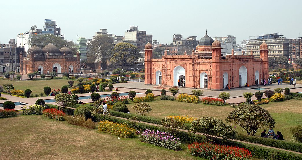 Lalbagh Fort in Dhaka, Bangladesh. This is the tomb of Bibi Pari in the grounds of Lalbagh Fort, Dhaka. To the left with three domes is Lalbagh Fort Mosque. Tourist sight in Dhaka, Bangladesh.