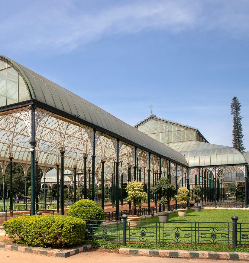 BANGALORE, KARNATAKA, INDIA - OCTOBER 20, 2018: The Lalbagh Botanical Gardens (Red Gardens) in Bangalore (Bengaluru) India.  One of the main features of the gardens, the Lalbagh Glass House.