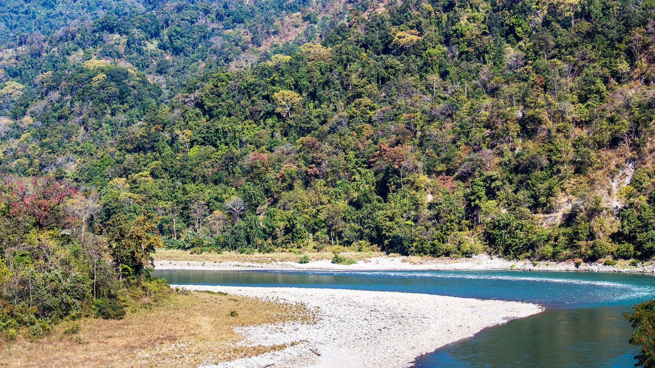 Scenic view of water flow between hills in Manas National Park, Assam, India