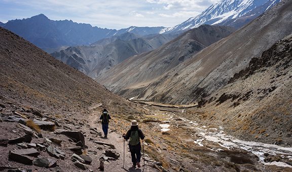 A man and a woman trekking on Markha valley trekking route - Leh Ladakh - India