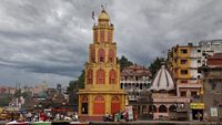 NASHIK, INDIA- JUNE 23, 2019: Beautiful landscape capturing colorful temples, shops, vendors and Ramkund on the banks of the Godavari river in Panchavati in city. A day in an Indian city. Religious.