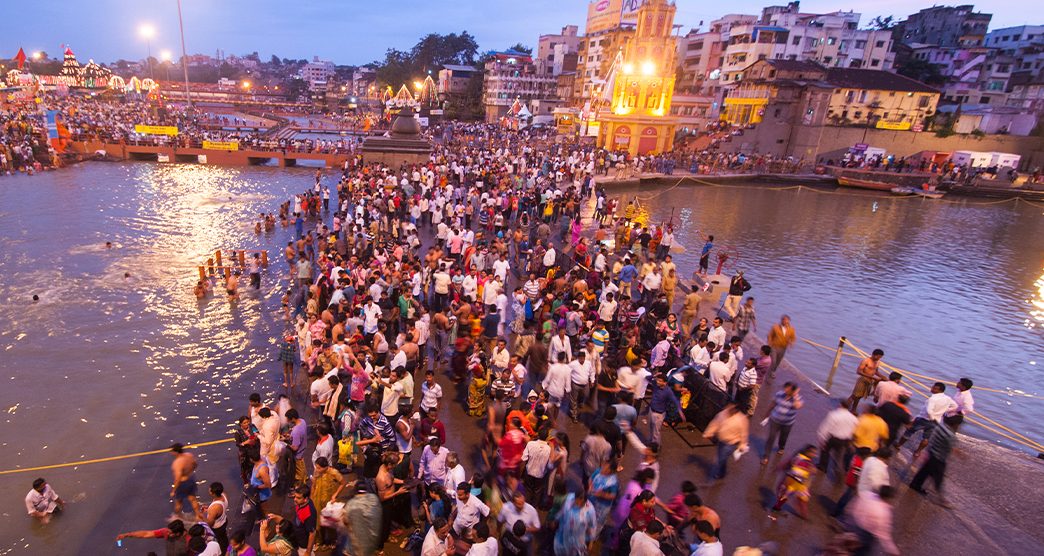 NASHIK, INDIA  29 AUGUST 2015 : Unidentified devotees take a holy bath at the Ramghat on the Godavari River during the Simhastha Kumbh Mela, Nashik, Maharashtra, India.