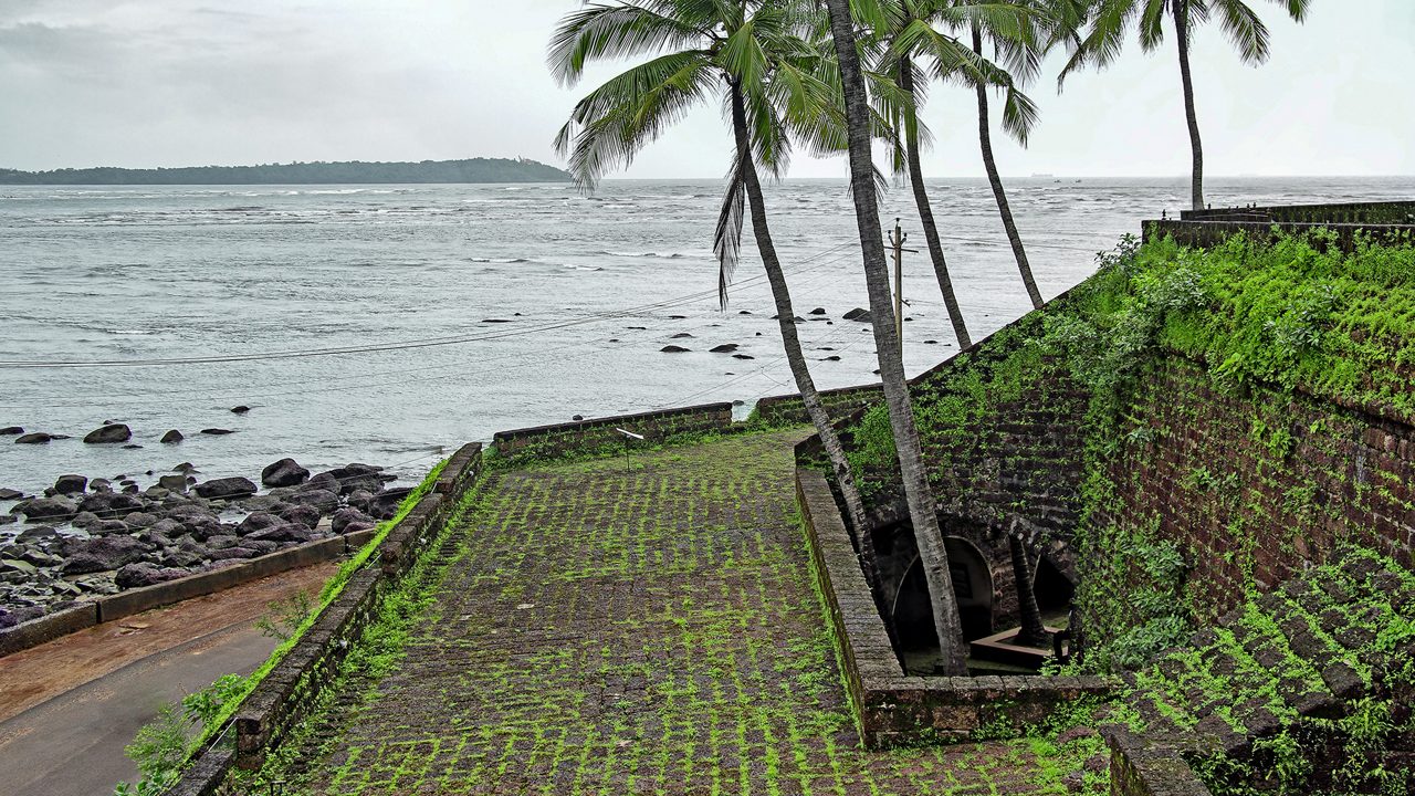Mandovi River side structures and sea view of Portuguese period Reis Magos Fort in Goa, India. ; Shutterstock ID 1079180624; purchase_order: -; job: -; client: -; other: -