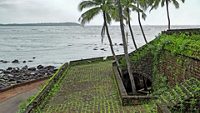 Mandovi River side structures and sea view of Portuguese period Reis Magos Fort in Goa, India. ; Shutterstock ID 1079180624; purchase_order: -; job: -; client: -; other: -
