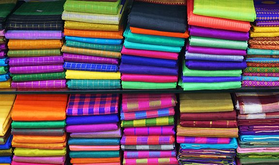 Colorful Managalagiri cotton saris on racks in a textile shop. Incredible India.                                  