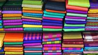 Colorful Managalagiri cotton saris on racks in a textile shop. Incredible India.                                  