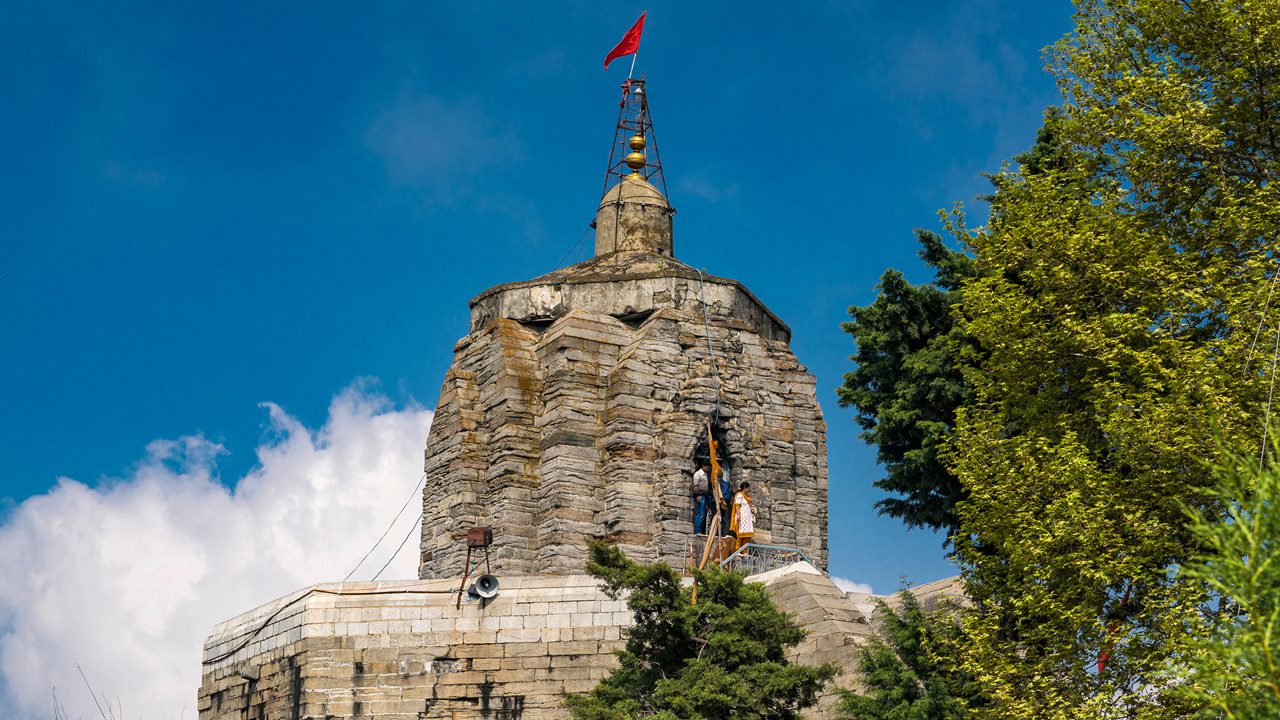 Srinagar,12,April ,2016,Kashmir India: Low angle view of ancient Shankaracharya  temple on hilltop  against  blue sky  background and surrounding greenery ,Srinagar,Jammu and Kashmir, India,Asia; Shutterstock ID 1116045194; purchase_order: -; job: -; client: -; other: -