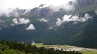 The mist covered craggy snow-melted mountains during monsoon look mesmerizing at Yumthang Valley situated at 12,000 ft altitude in Sikkim, India. 