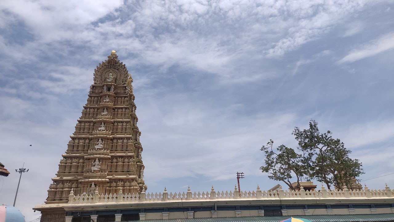 Landscape image of Sri Chamundeshwari Devi Temple with cloudy sky in the background