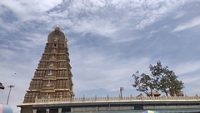 Landscape image of Sri Chamundeshwari Devi Temple with cloudy sky in the background