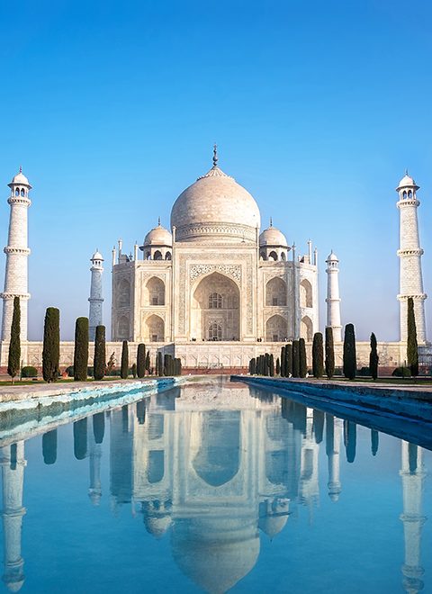 Agra, Uttar Pradesh, India - The morning view of Taj Mahal monument reflecting in water of the pool, Agra, India