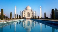 Agra, Uttar Pradesh, India - The morning view of Taj Mahal monument reflecting in water of the pool, Agra, India