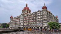 Mumbai, Maharashtra, India - August 11, 2019; The Taj Mahal Palace Hotel is a five-star luxury hotel located near Gateway of India Where lots of tourists are wandering and countless flocks of pigeons are sitting. Resorts & Palaces.