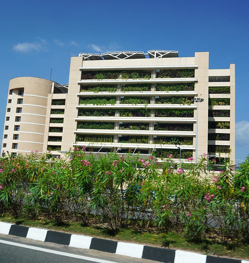 Trivandrum, Kerala, India, January 08, 2020: Street view of the multilevel parking facility of Infosys information technology company at Technopark, Kulathoor.                           