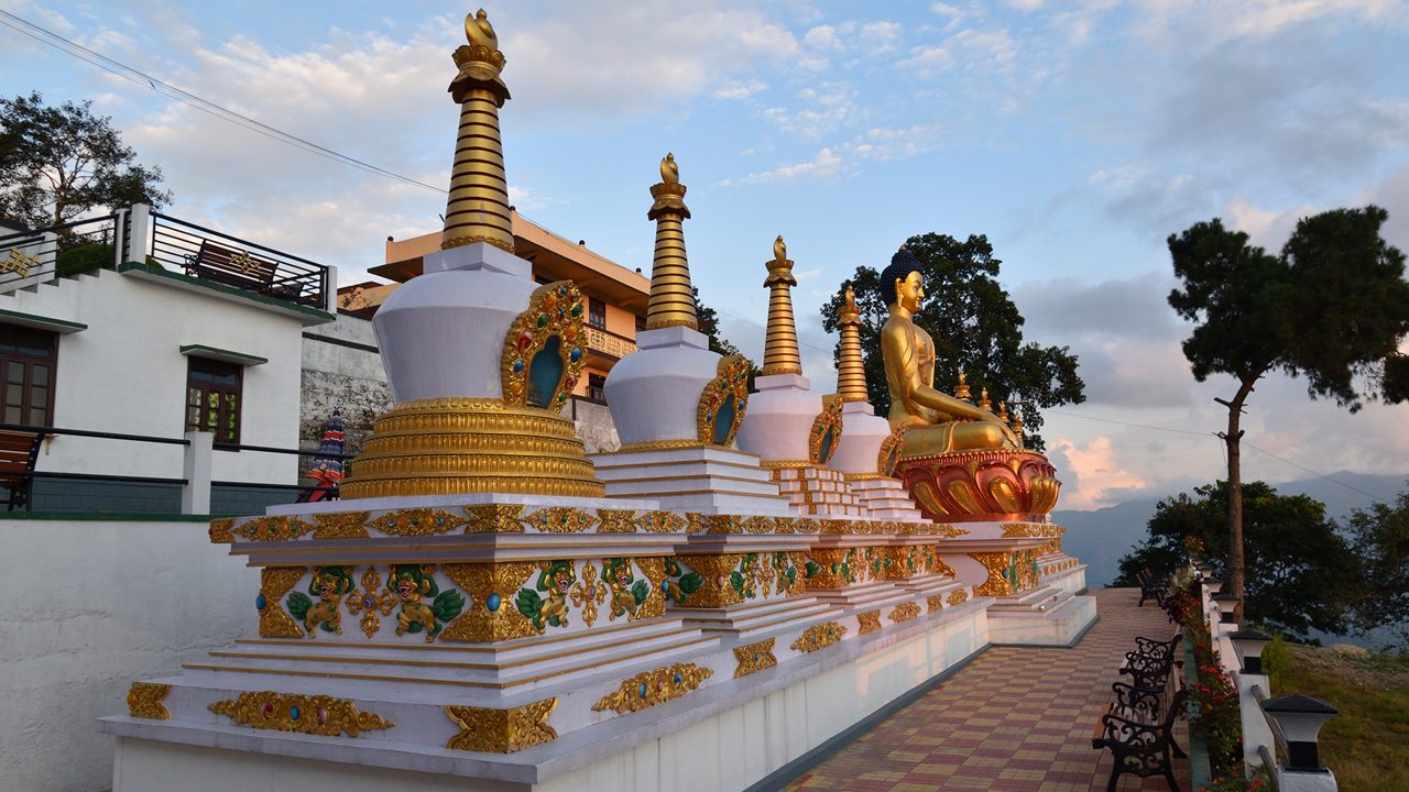 Buddha statue and stupas in the Tharpa Choling Monastery in Kalimpong, West Bengal, India