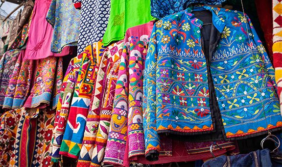 Traditional Indian clothes and accessories market at Udaipur city, Rajasthan, India