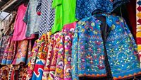 Traditional Indian clothes and accessories market at Udaipur city, Rajasthan, India