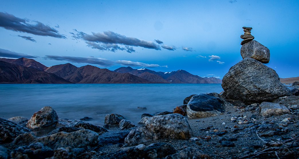 Morir lake with Buddhist stupa in forefront at blue hour - long exposure -  Tso Moriri Wetland Conservation Reserve, Himalayan mountain lake, Korzok Changthang area, Leh, Ladakh