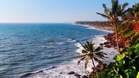 View of Varkala beach and palm trees. Kerala. India