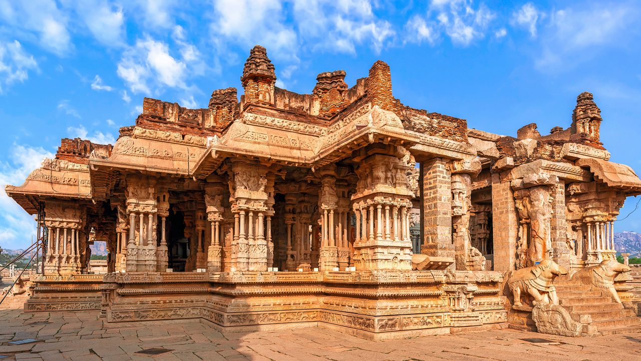 Beautiful medieval stone architecture with intricate carvings inside Vijaya Vittala temple at Hampi, Karnataka, India