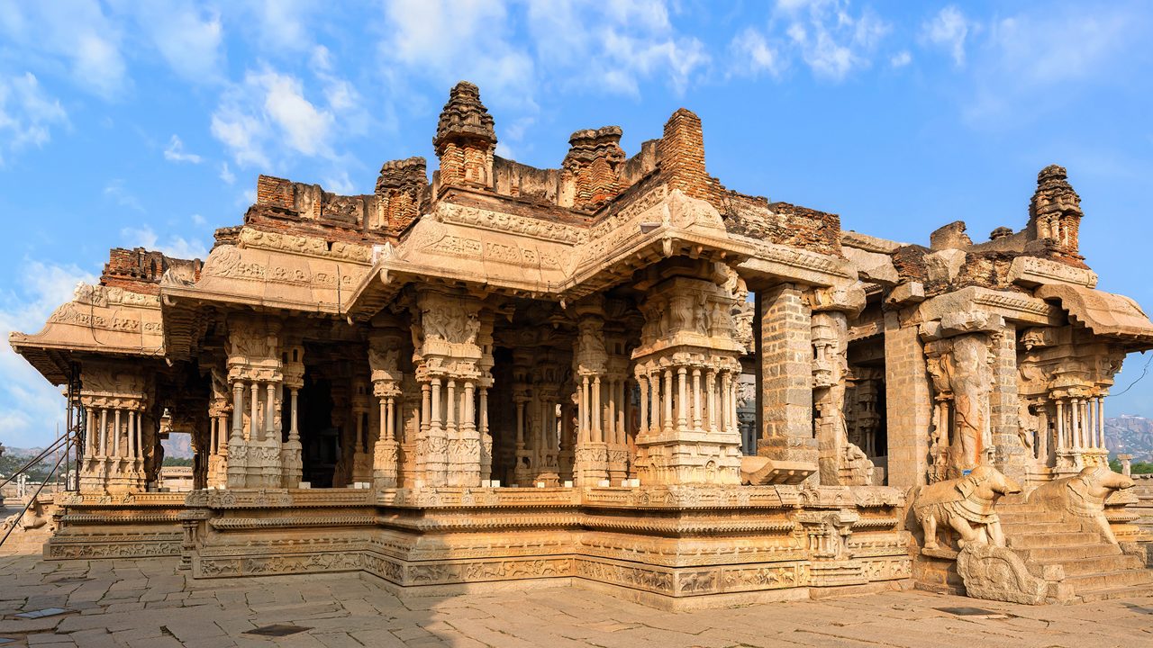 Beautiful medieval stone architecture with intricate carvings inside Vijaya Vittala temple at Hampi, Karnataka, India