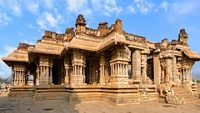 Beautiful medieval stone architecture with intricate carvings inside Vijaya Vittala temple at Hampi, Karnataka, India