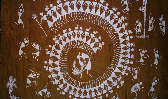 Warli Painting on the wall of a Indian Village Hut of Maharashtra