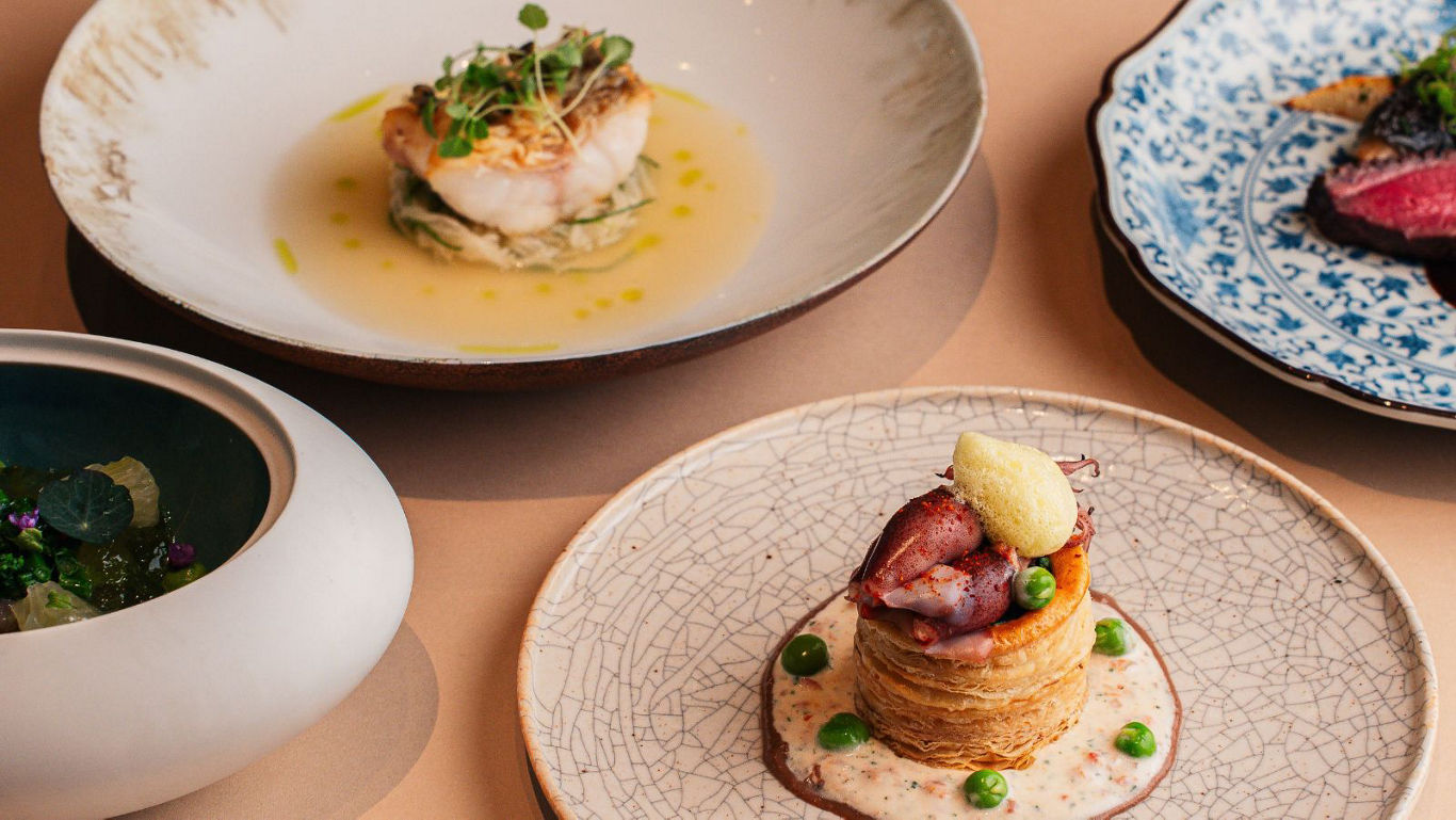 Gourmet fine dining dishes on elegant plates