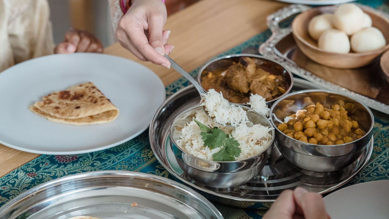 Serving traditional Indian meal with thali