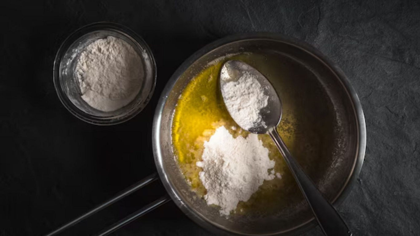 Flour and melted butter in saucepan for cooking