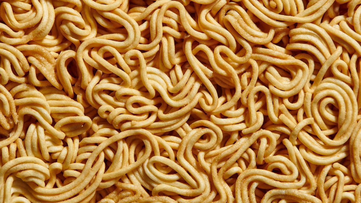 Close-up texture of uncooked instant noodles