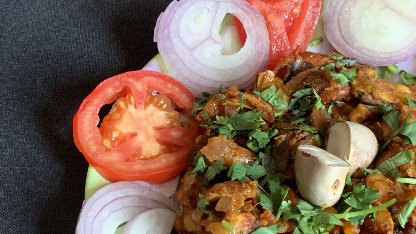 Spiced Vegetable Curry Garnished with Fresh Herbs