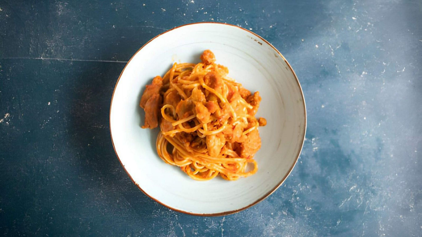 Creamy Pasta with Chicken on Blue Tabletop