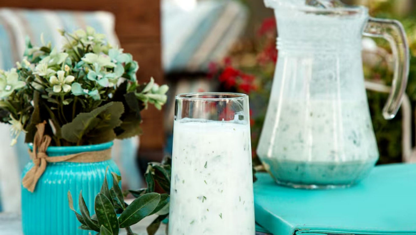 Refreshing Herb Drink in Glass and Pitcher