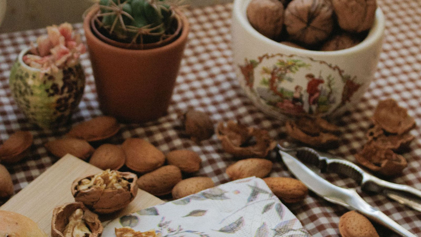 Rustic table with nuts and kitchen tools