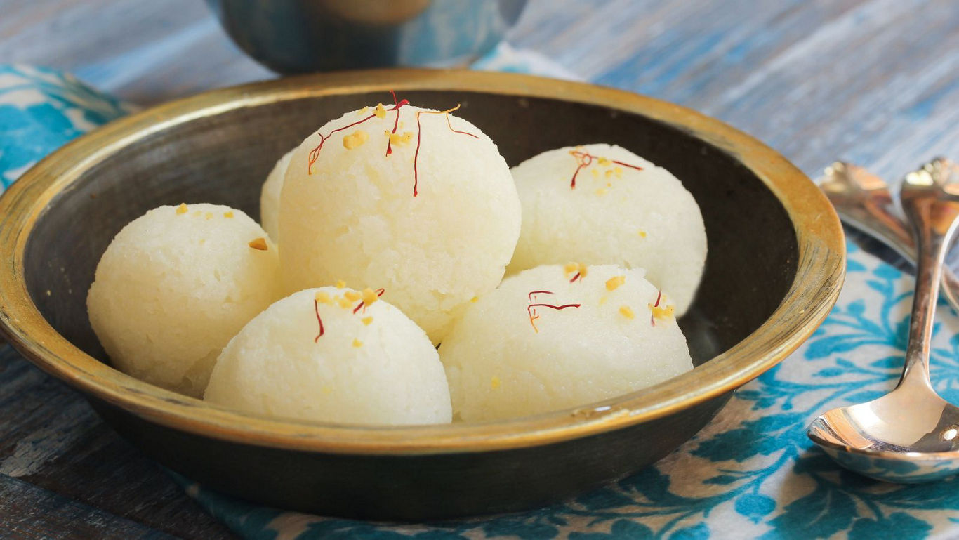Traditional Indian rasgulla dessert in bowl