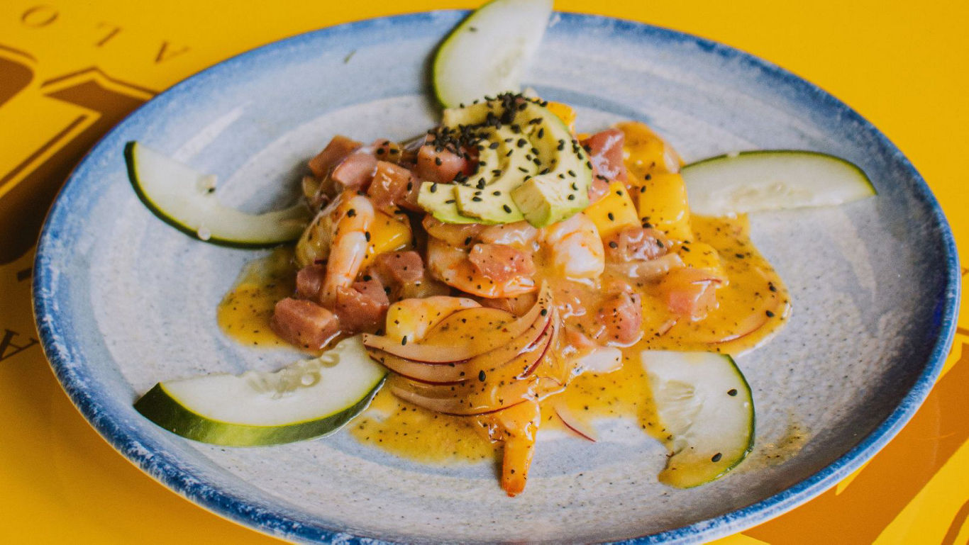 Gourmet ceviche-style dish with avocado slices