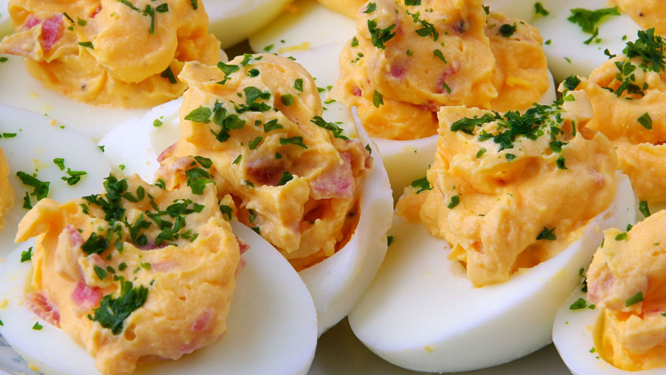 Close-up of deviled eggs with parsley garnish