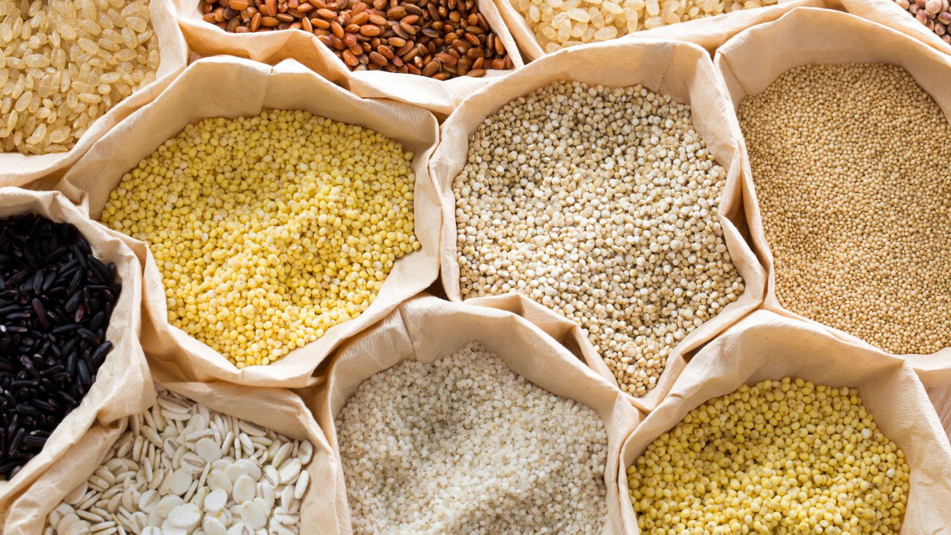 Assorted grains and seeds in paper bags