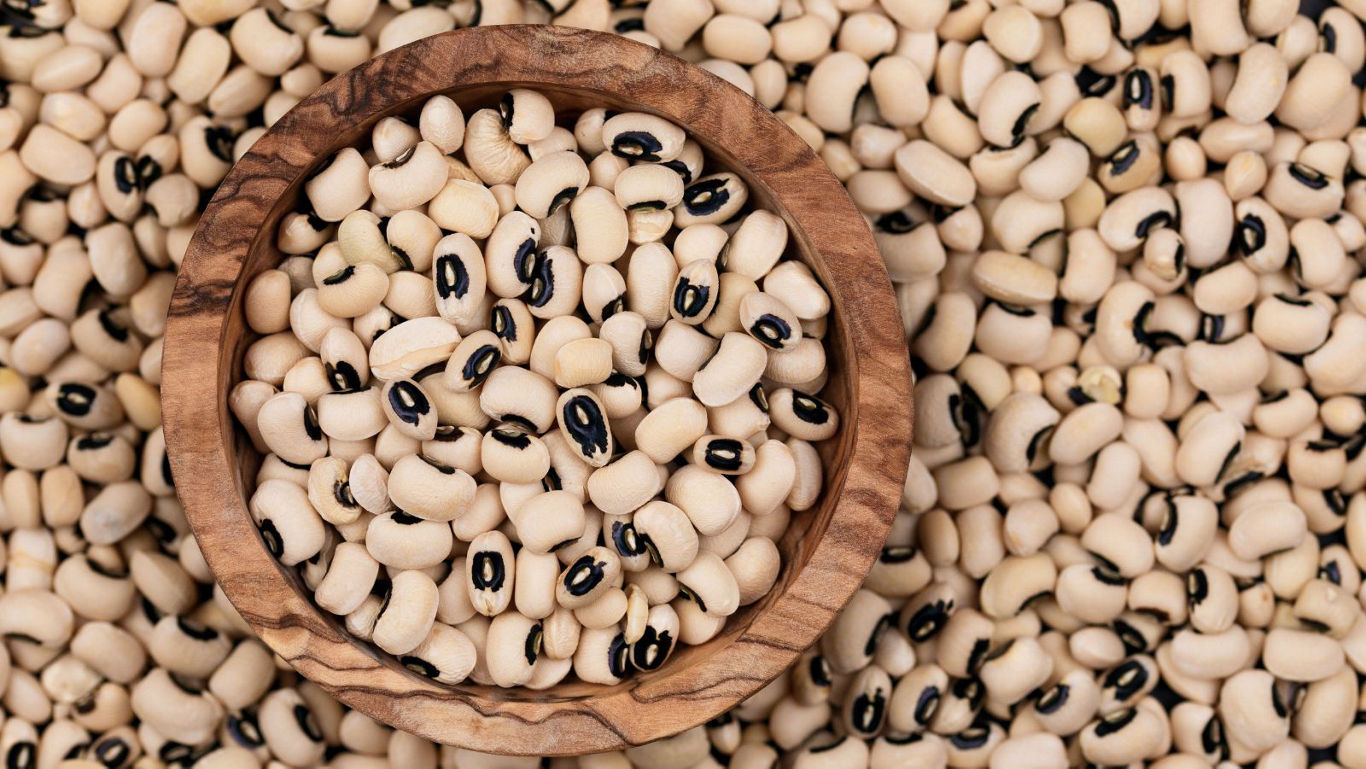 Wooden bowl filled with black eyed peas