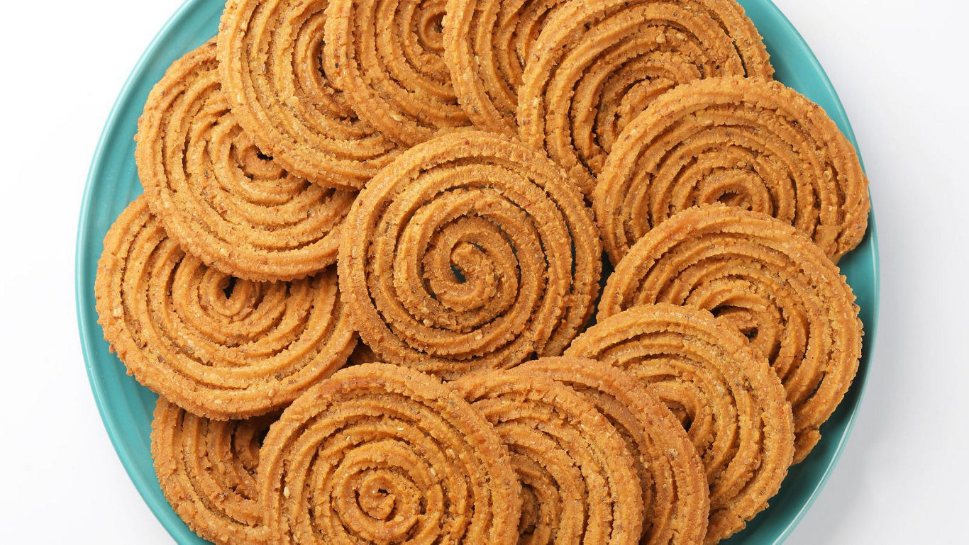 Spiral Indian snacks arranged on plate
