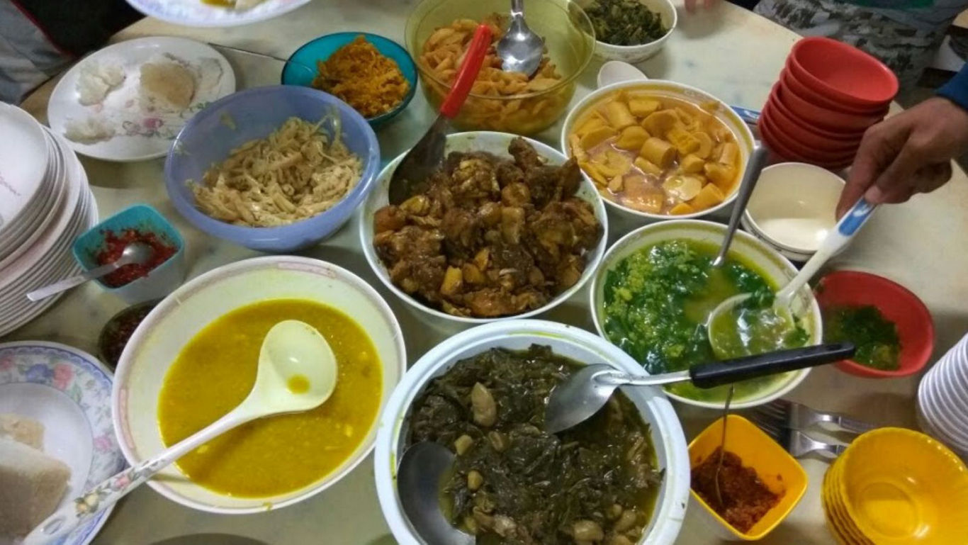 Traditional Malaysian Feast with Various Dishes Served