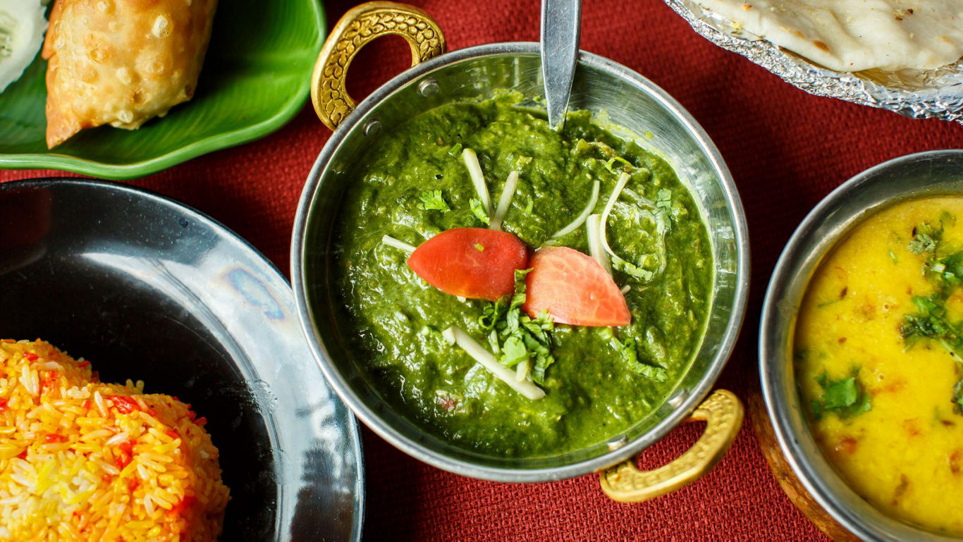 Indian vegetarian meal with spinach curry
