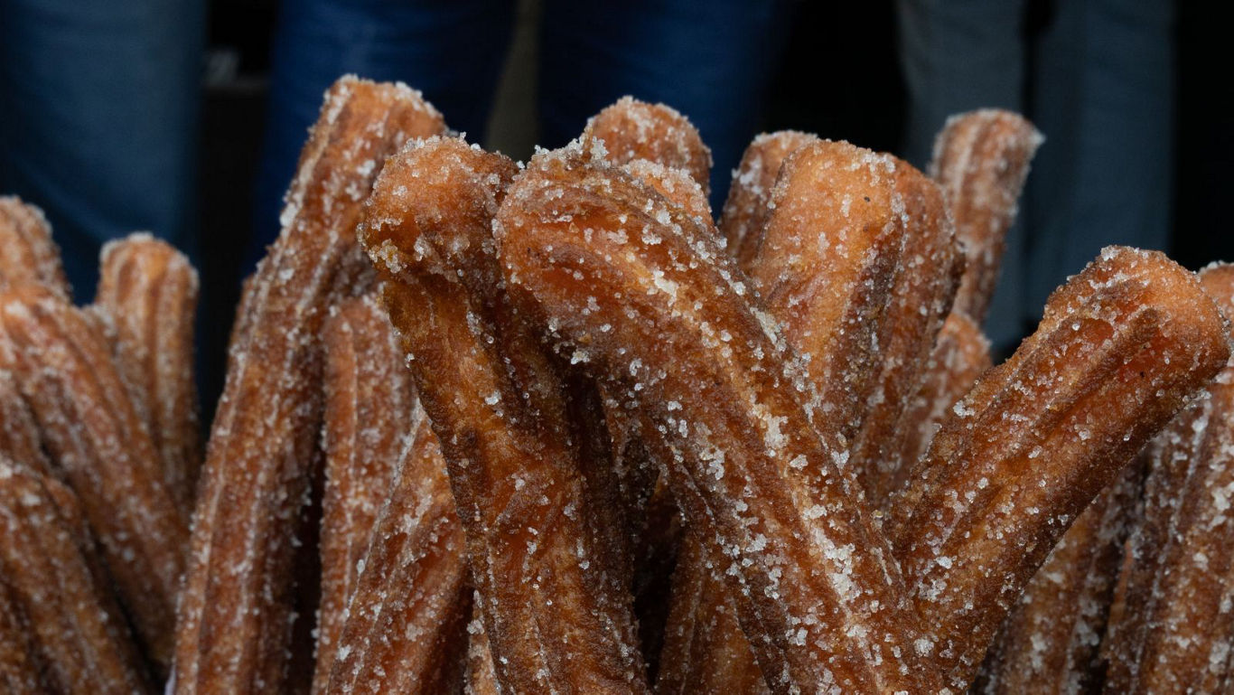 Close-up of sugar-coated churros dessert