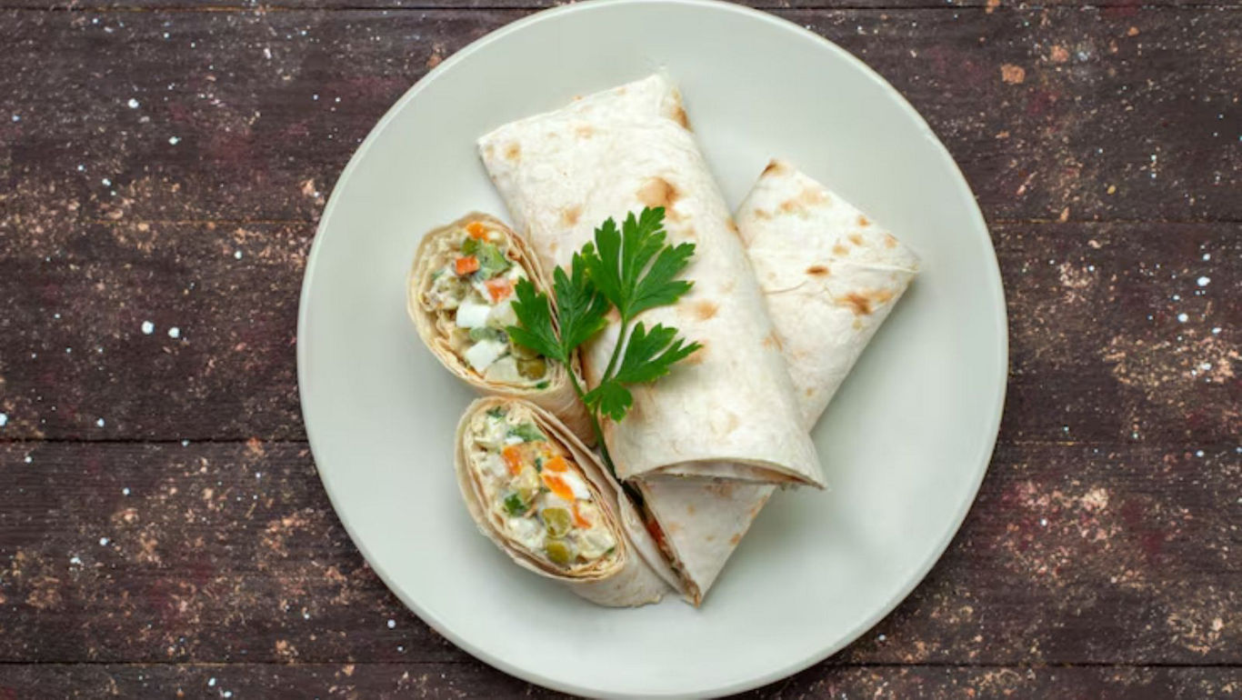 Fresh vegetable wraps on rustic plate